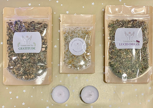 lucid dream tea, gratitude tea and a bath salt with two candles