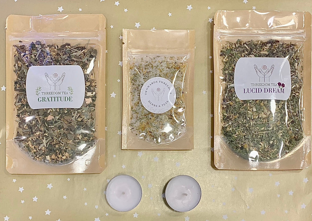 lucid dream tea, gratitude tea and a bath salt with two candles